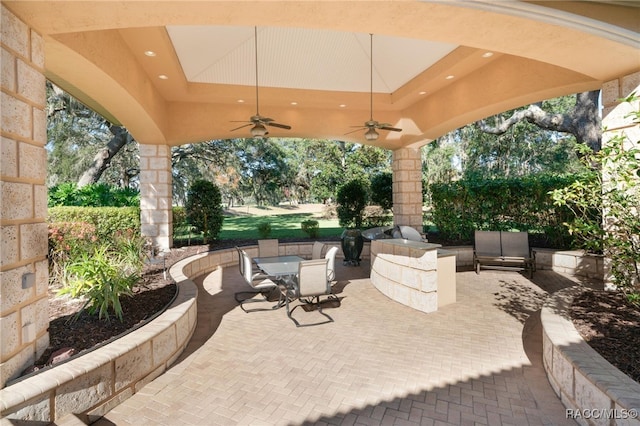 view of patio / terrace featuring ceiling fan