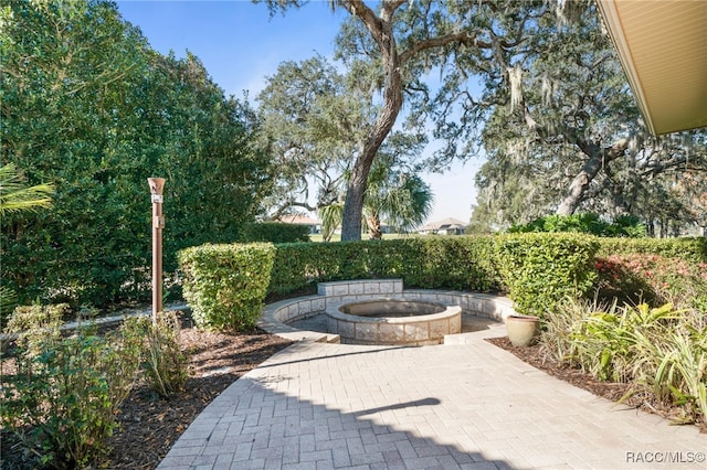 view of patio featuring an outdoor fire pit