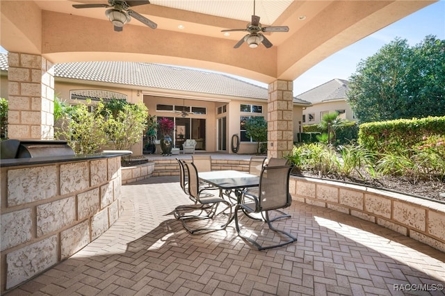 view of patio / terrace featuring area for grilling and ceiling fan