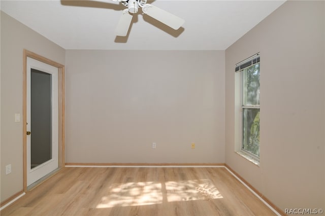 unfurnished room with light wood-type flooring and ceiling fan