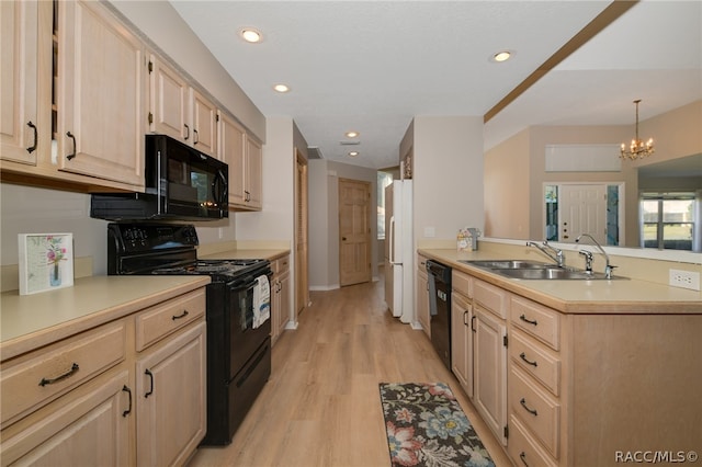 kitchen with light brown cabinets, sink, a notable chandelier, light hardwood / wood-style floors, and black appliances