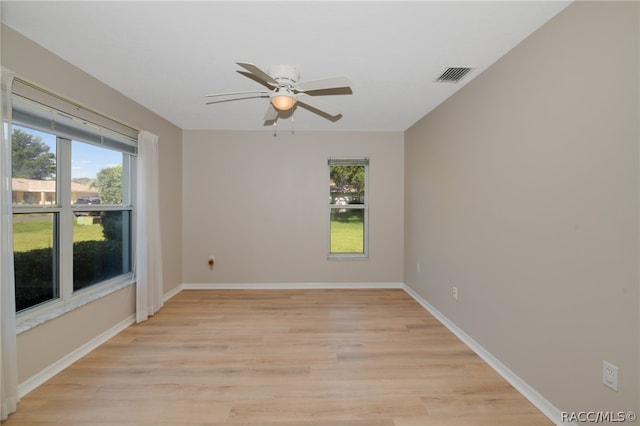 spare room with light hardwood / wood-style floors and ceiling fan