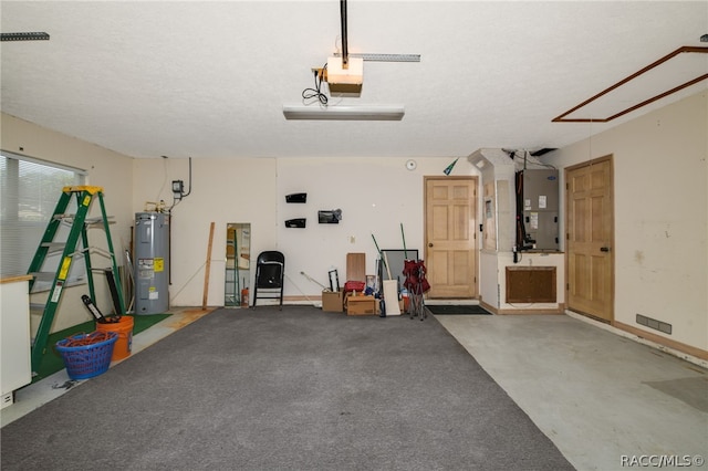 garage featuring heating unit, a garage door opener, and water heater