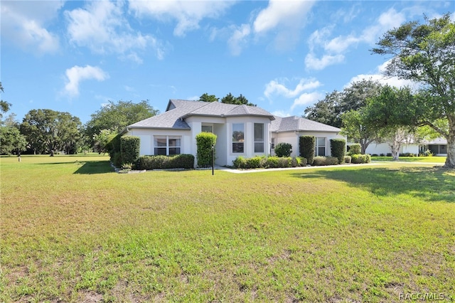 view of front of property with a front lawn