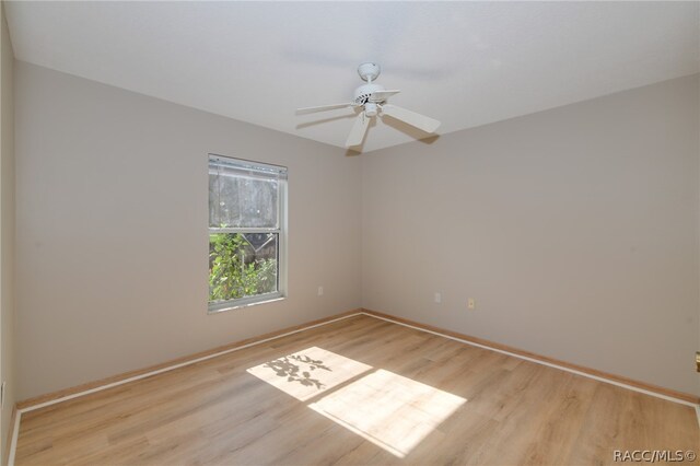 spare room with ceiling fan and light hardwood / wood-style floors