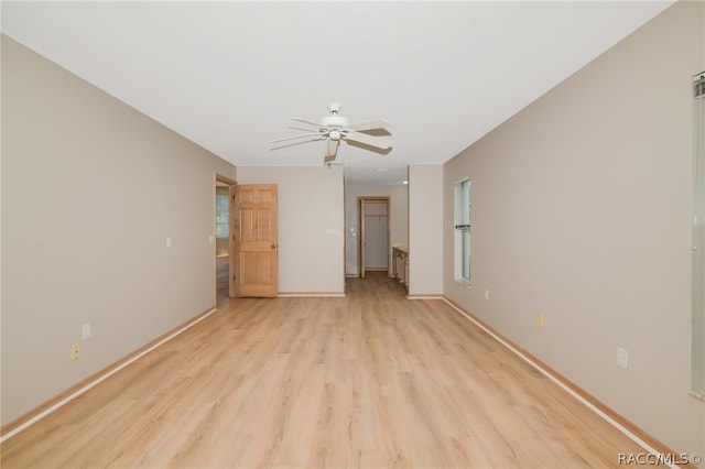 empty room with light wood-type flooring and ceiling fan