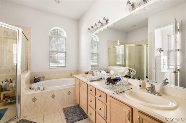 bathroom featuring tile patterned floors, vanity, and independent shower and bath