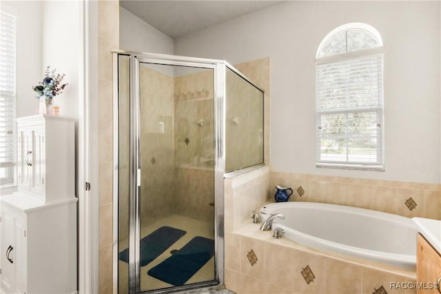 bathroom featuring vanity and plus walk in shower