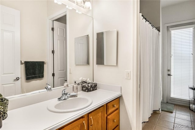 bathroom with tile patterned flooring and vanity