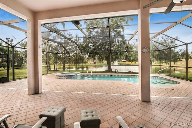 view of pool with an in ground hot tub, glass enclosure, and a patio area