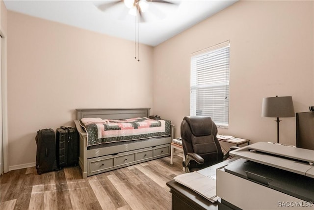 bedroom featuring ceiling fan and light hardwood / wood-style flooring