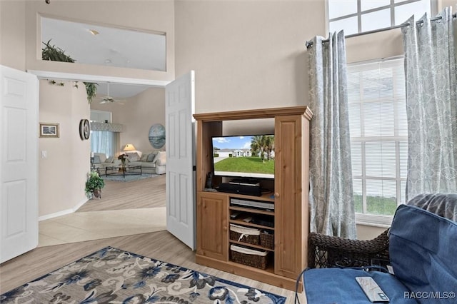 158 N Skyflower Pt, Lecanto, FL 34461 - entryway with light wood-style floors, a high ceiling, and ceiling fan