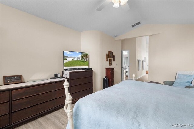 158 N Skyflower Pt, Lecanto, FL 34461 - bedroom featuring light wood finished floors, lofted ceiling, and ceiling fan