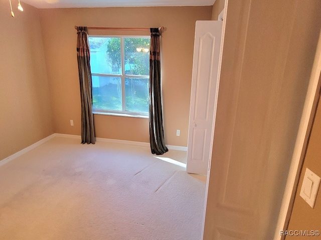 unfurnished room with carpet flooring