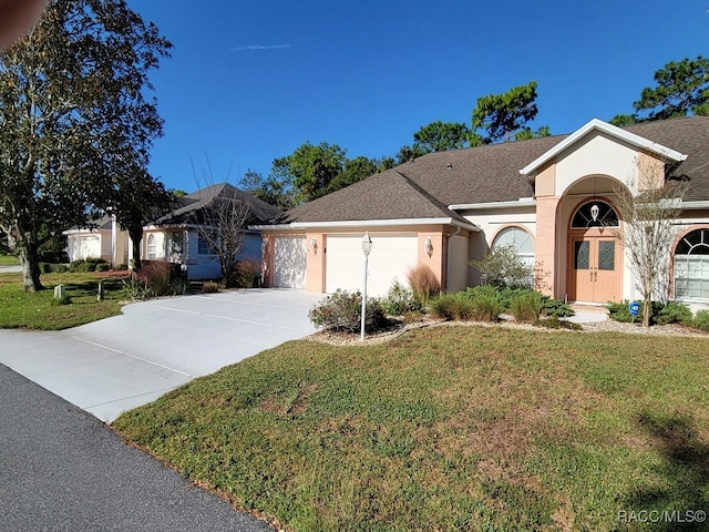 ranch-style house with a front yard and a garage