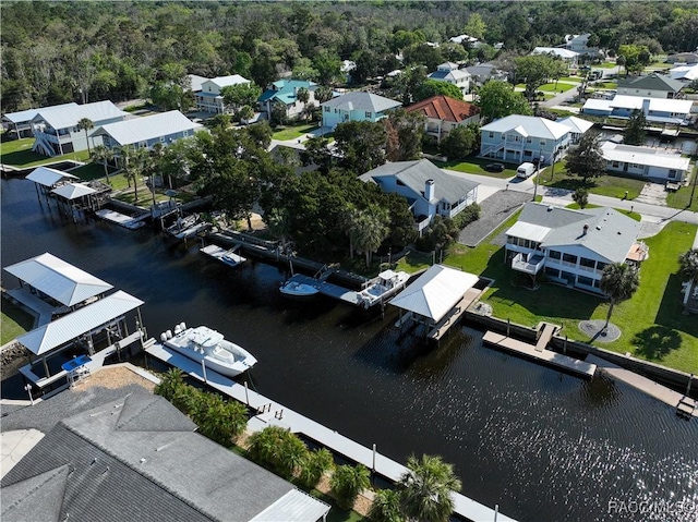 bird's eye view with a residential view and a water view