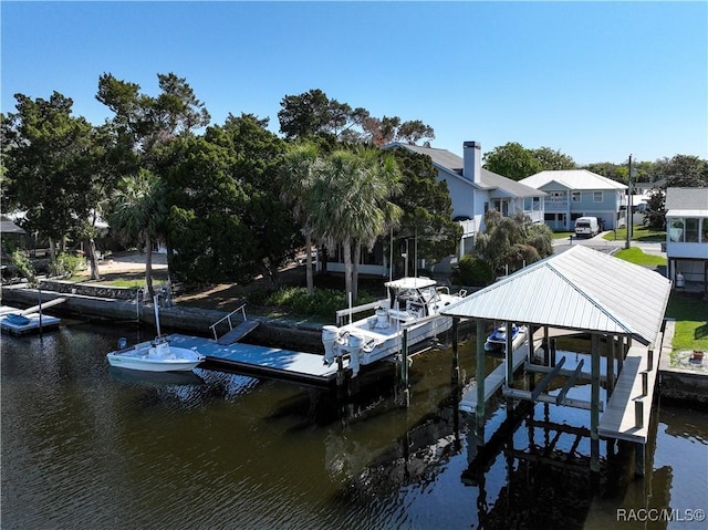 view of dock with a water view and boat lift
