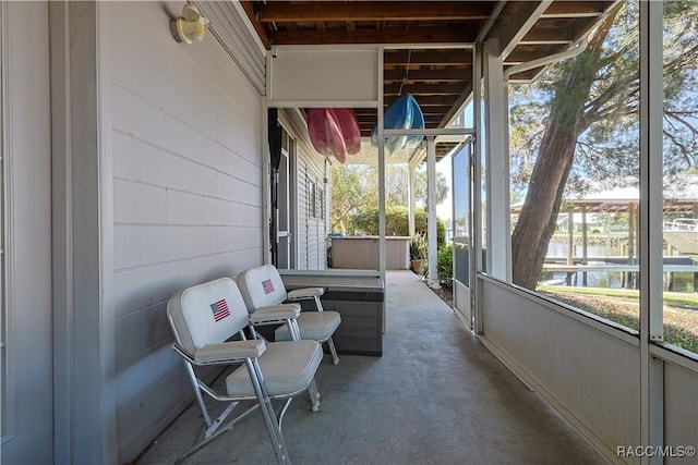 sunroom / solarium with a water view