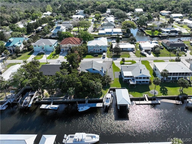 bird's eye view with a water view and a residential view
