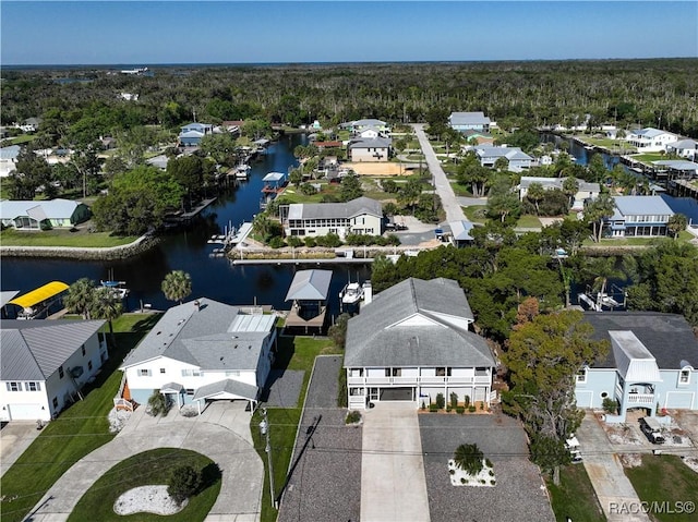 drone / aerial view featuring a residential view and a water view