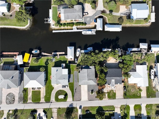 bird's eye view featuring a water view and a residential view