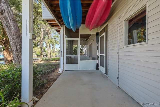 view of patio with a sunroom