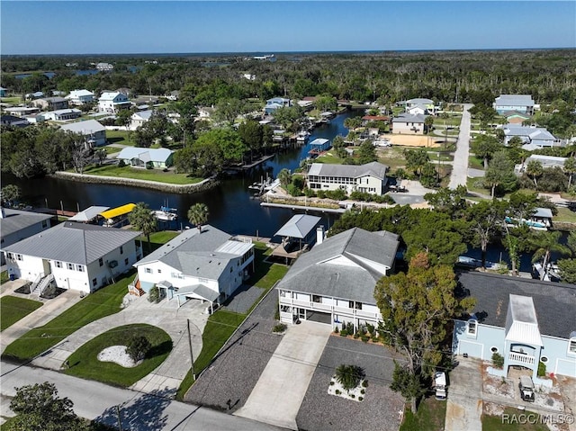 drone / aerial view featuring a residential view and a water view