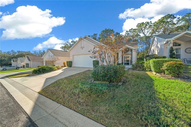 view of front of house with a garage and a front lawn