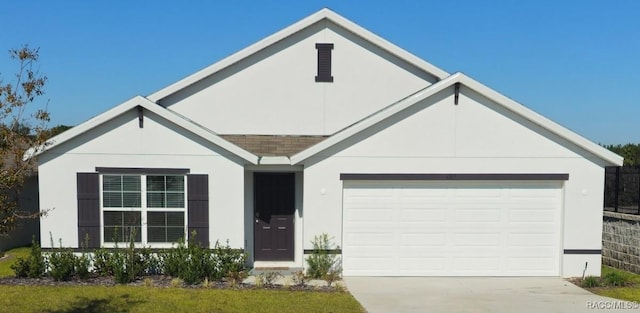 ranch-style home featuring a garage