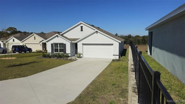 view of front of home with a garage and a front yard