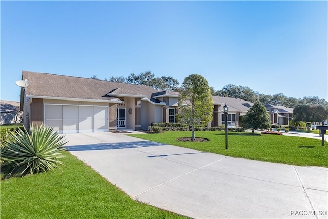 view of front of home featuring a garage and a front yard