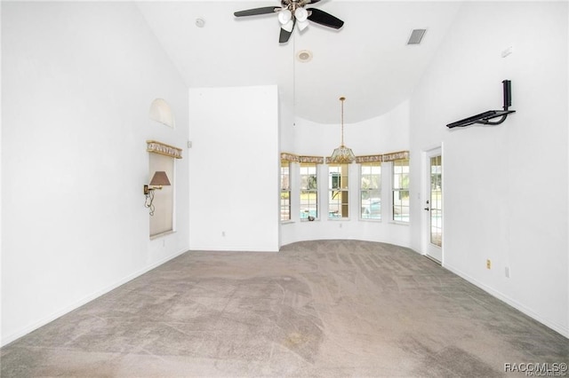 unfurnished living room featuring ceiling fan, light carpet, and high vaulted ceiling