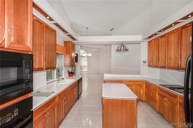 kitchen with black appliances, decorative light fixtures, a kitchen island, lofted ceiling, and light tile patterned flooring