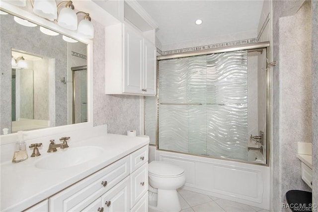 full bathroom with tile patterned floors, vanity, enclosed tub / shower combo, and toilet