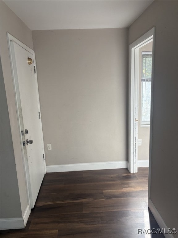 spare room featuring dark hardwood / wood-style flooring