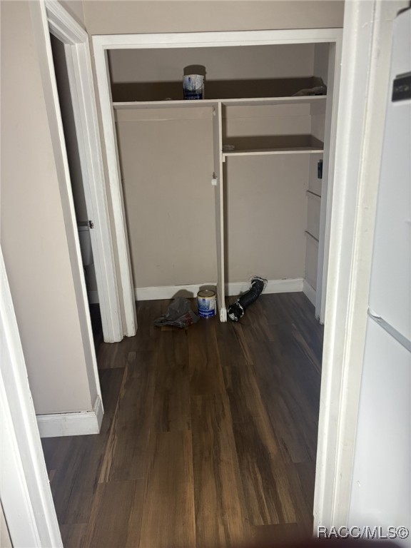 laundry room featuring dark hardwood / wood-style flooring