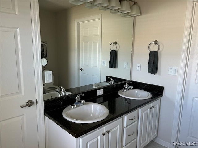 bathroom featuring double vanity and a sink