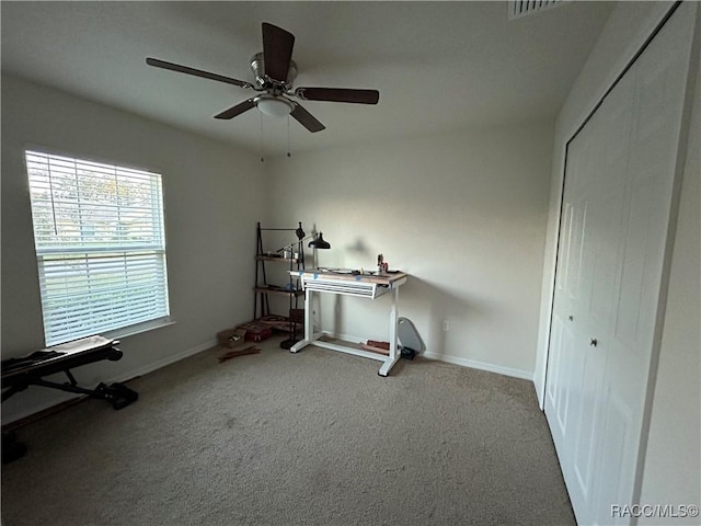 workout area with ceiling fan, visible vents, baseboards, and carpet flooring