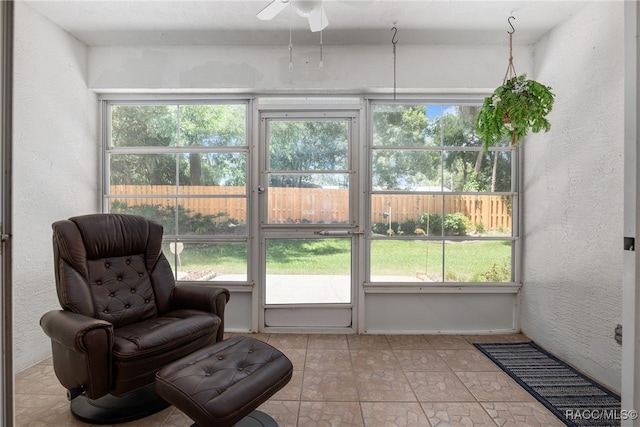 sunroom featuring plenty of natural light and ceiling fan