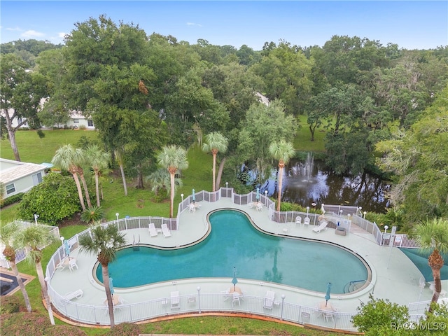 view of swimming pool with a water view