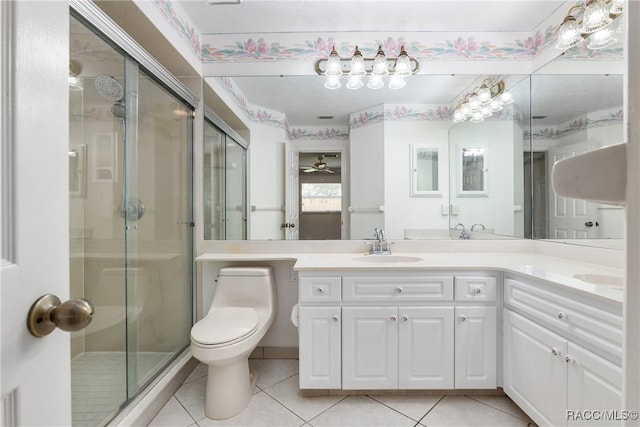 bathroom with tile patterned floors, ceiling fan, toilet, and walk in shower