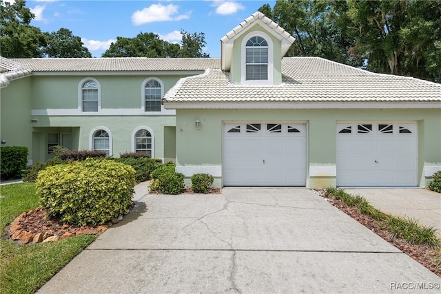 view of front of property with a garage