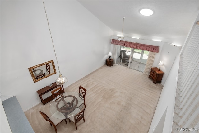 carpeted living room with ceiling fan