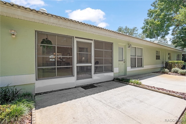 rear view of house featuring a patio area