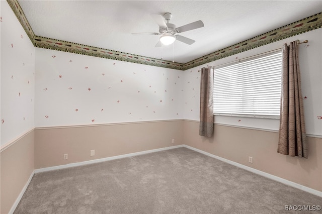 empty room with light carpet and ceiling fan