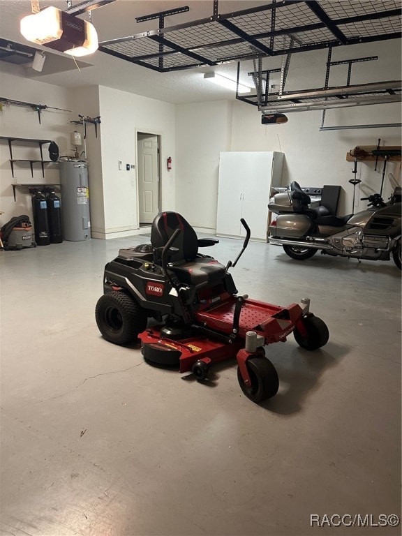 garage with electric water heater and a garage door opener