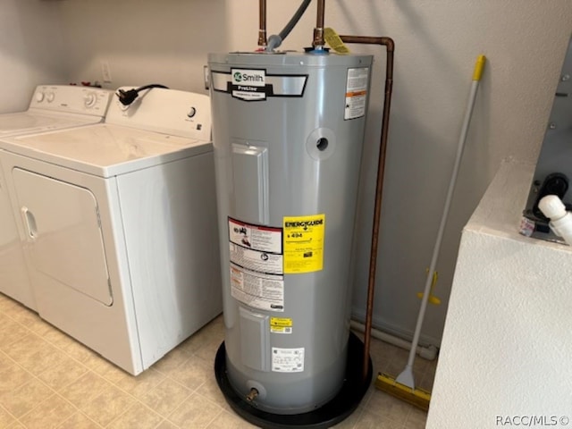 laundry area with washing machine and dryer and water heater