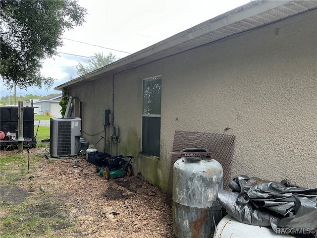 view of side of home with cooling unit