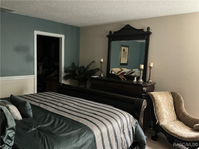 bedroom featuring a textured ceiling