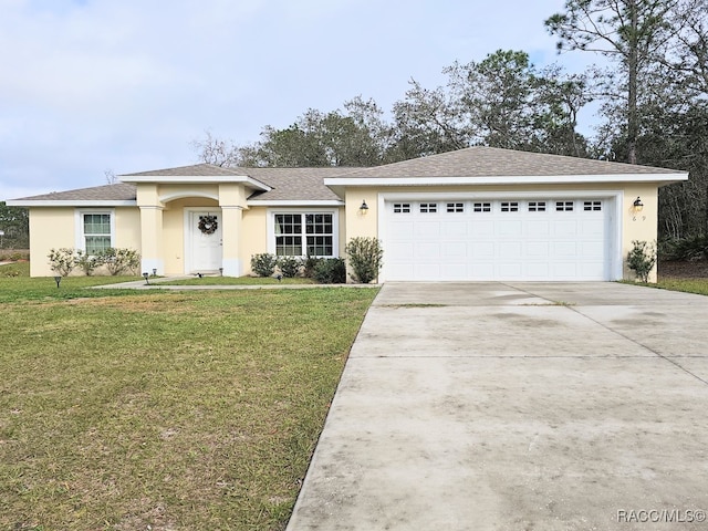 view of front of home with a garage and a front yard